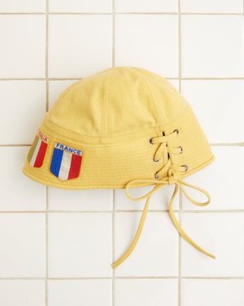 A yellow Patched Sailor Cap made of cotton twill, featuring 