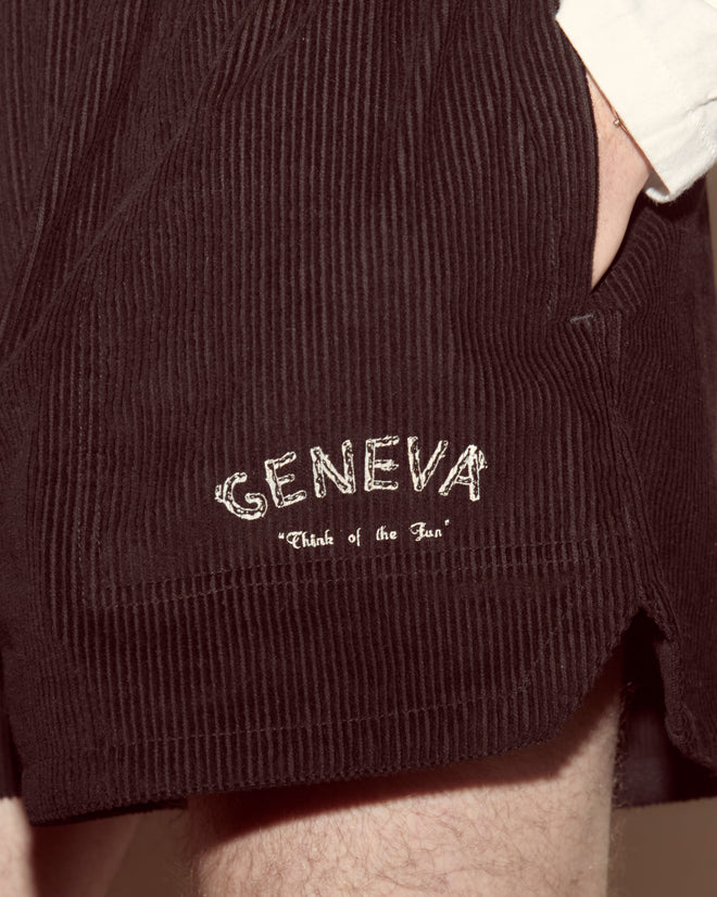 A close-up of Geneva Corduroy Shorts, showcasing a vintage 1970s cut and “GENEVA ‘Think of the fun’” embroidered on the pocket.