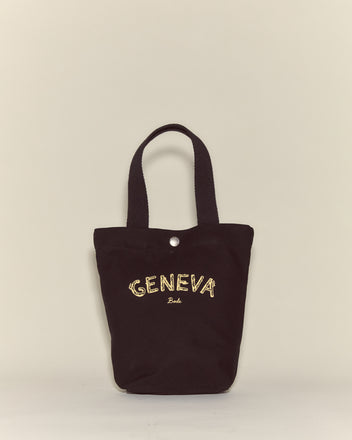 The Small Geneva Tote is a black canvas bag featuring 