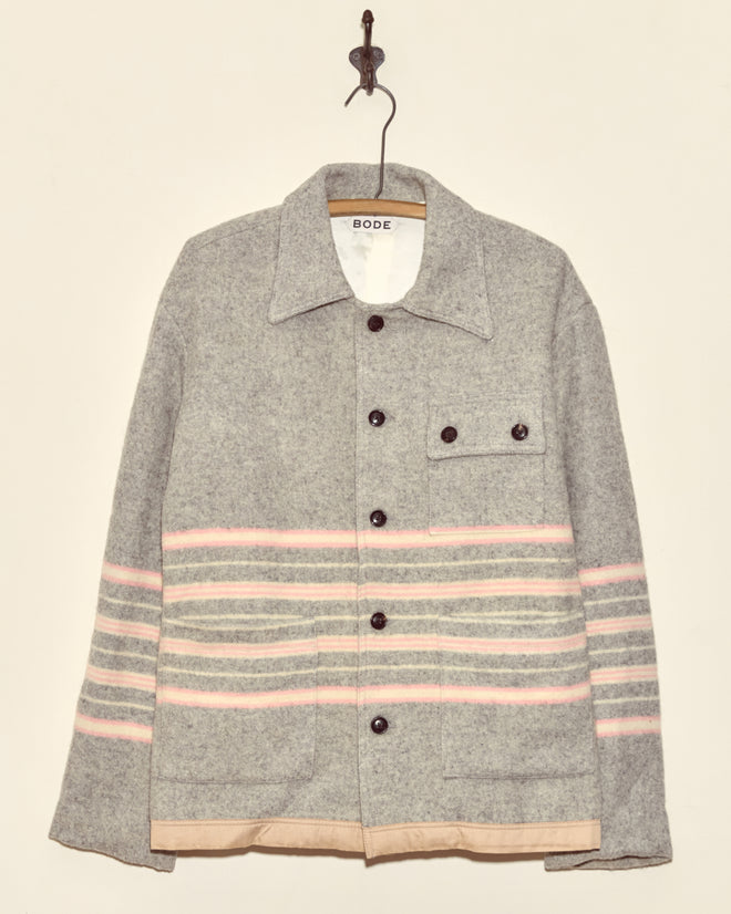 Gum Tree Stripe Jacket (XS) with pink and white horizontal stripes, crafted from wool in New York, hangs on a hook.