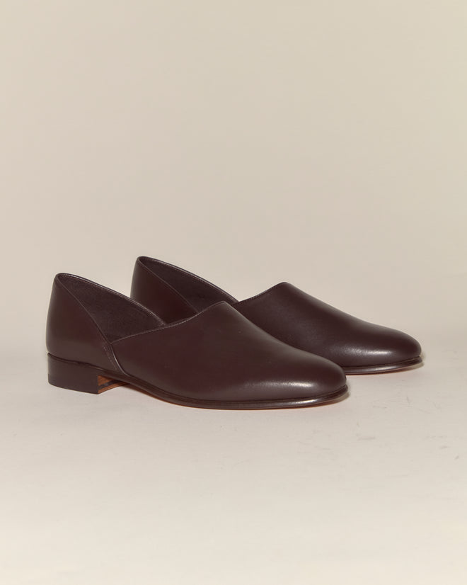 A pair of Leather House Shoes - Brown made from dark brown Napa leather, featuring a low heel, displayed on a neutral background.