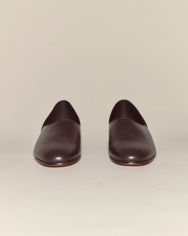 Leather House Shoes - Brown: minimalist Italian leather slip-ons in dark brown, made in Italy and photographed from the front against a plain light background.
