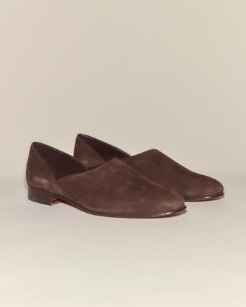 The Suede House Shoes - Brown are Italian suede slip-ons with low heels and a leather sole, displayed against a neutral background.