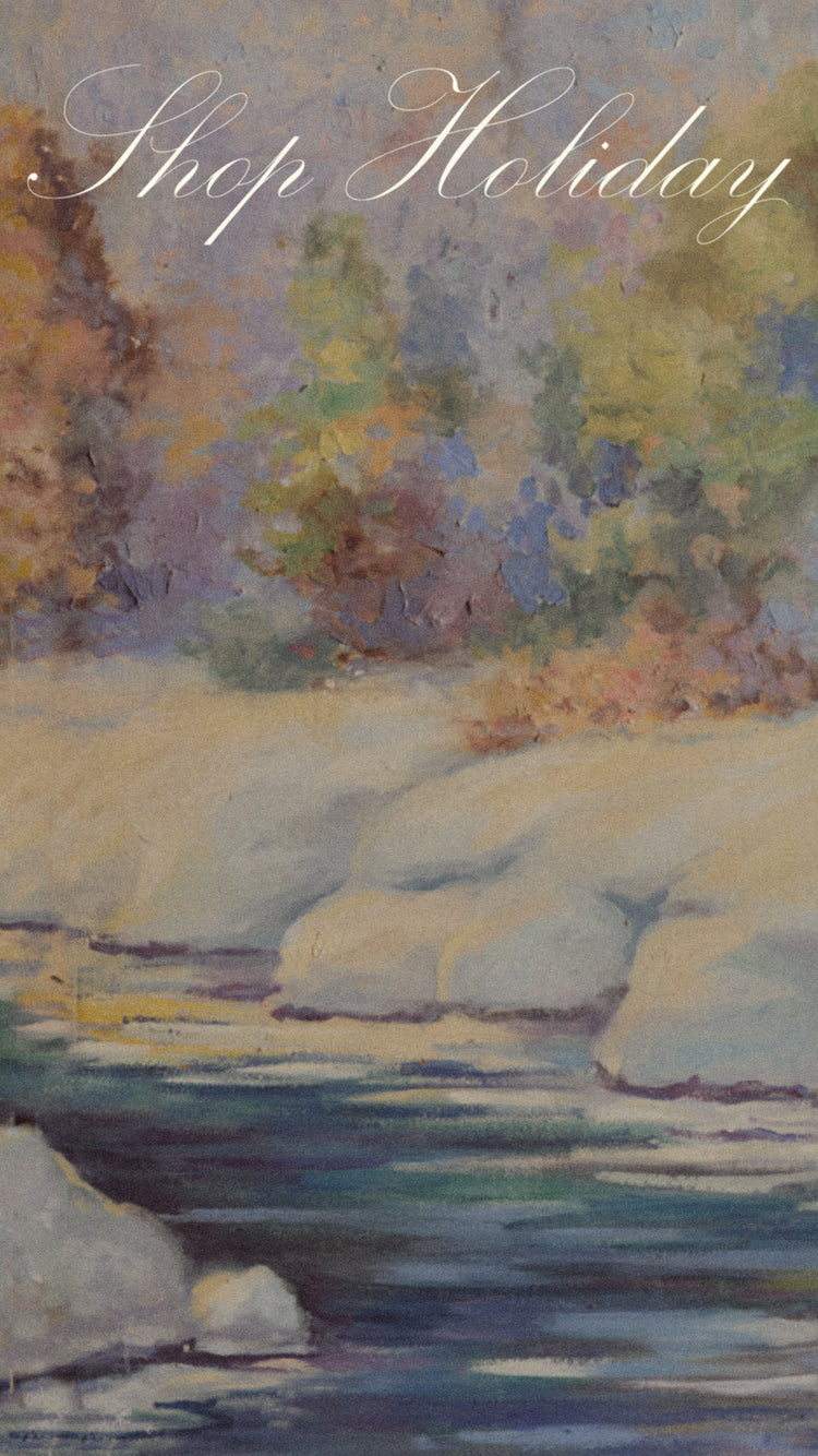 A hand painted backdrop of a snowy winter scene, with the words 