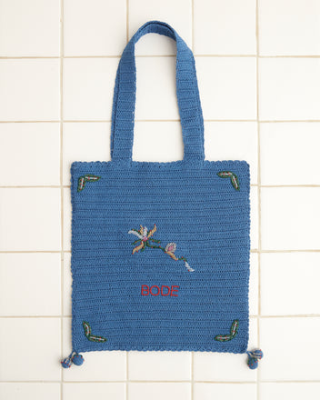 Laurel Crochet Tote in blue featuring an embroidered floral design with the word 