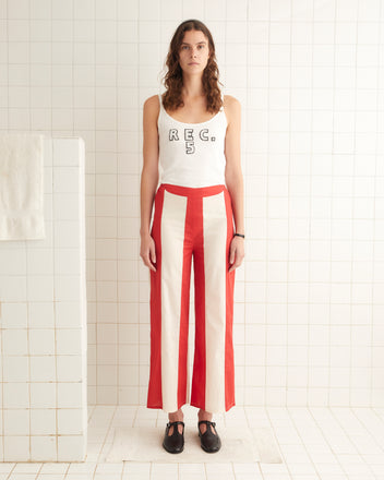 Red and cream cotton mid-rise pants with a horizontal stripes and an elastic waist.