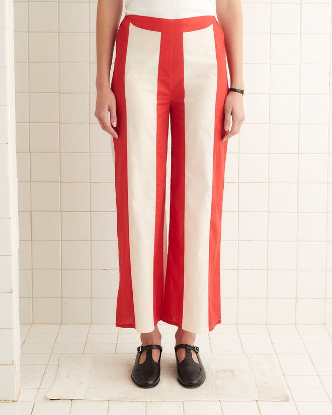 Red and cream cotton mid-rise pants with a horizontal stripes and an elastic waist.