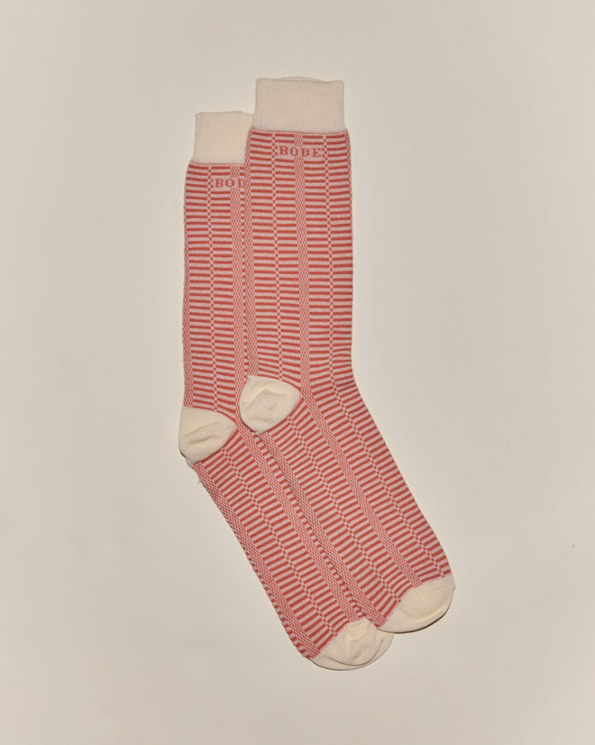 Peach and cream micro check socks with cream toes, heels, cuffs, and "BODE" text near the top, inspired by vintage children's socks.