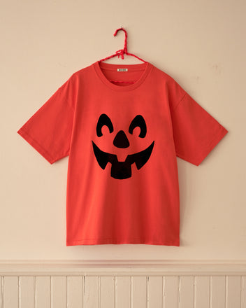 Red Pumpkin Tee with a black pumpkin face graphic.
