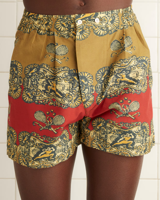 Yellow, red, and black printed cotton and silk boxer short featuring all over illustration of tennis players and rackets.