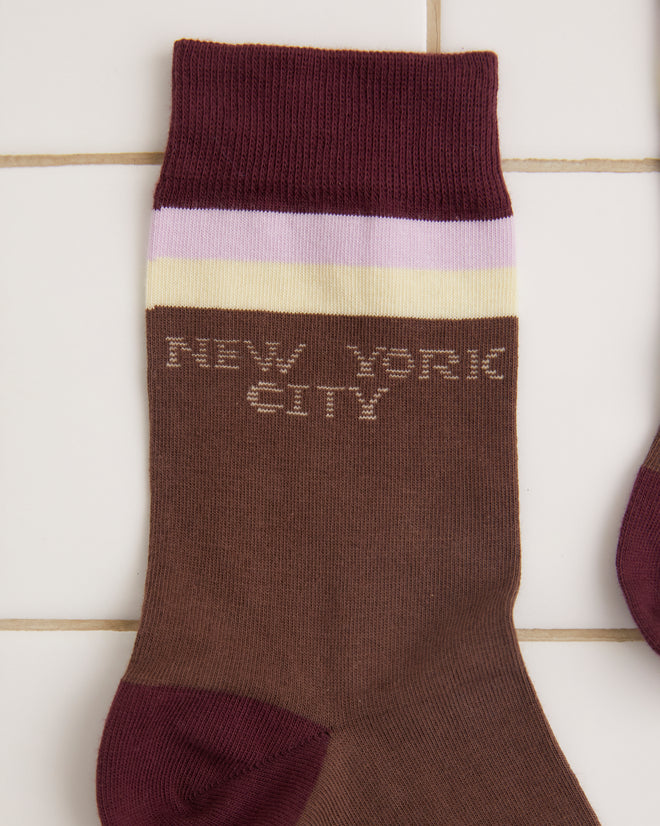 The Fairground Socks - Brown, featuring maroon toes and cuffs, the text 