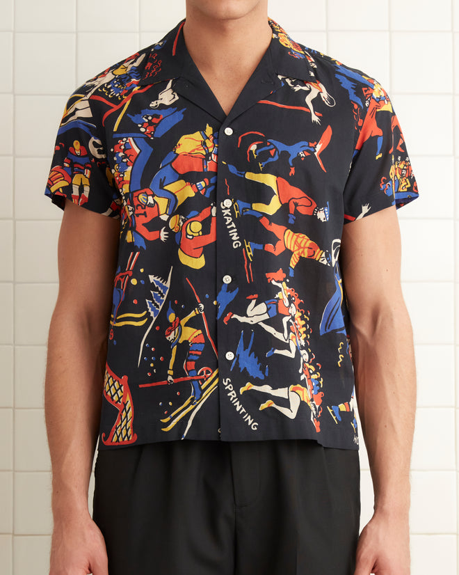 Cotton shirt patterned with multi-colored illustrations of different sports and activities.