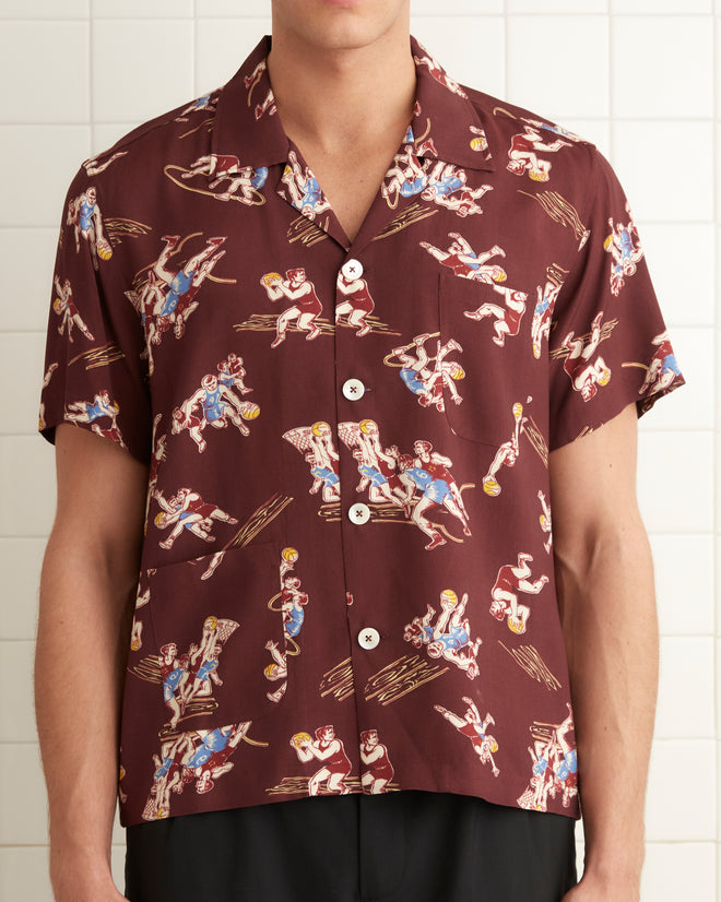 Burgundy viscose shirt with basketball player print all over garment.