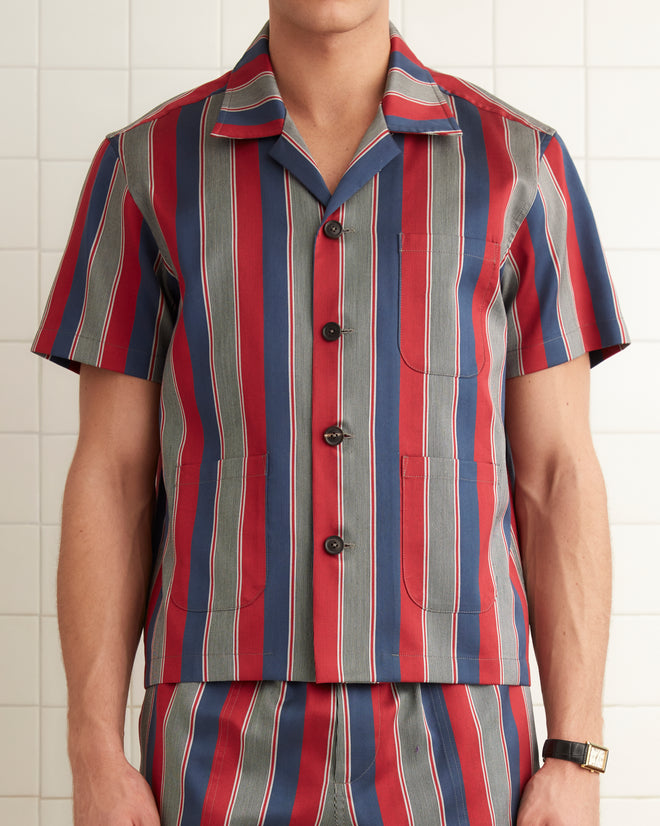 Red, gray, and navy striped cotton viscose blend short sleeve shirt with 5 button closure down the chest.