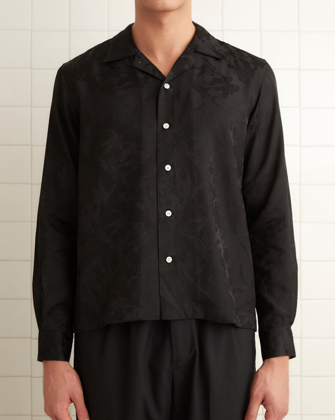 Black silk and viscose blend long sleeve shirt with football player jacquard print. Five button finish with pointed collar.