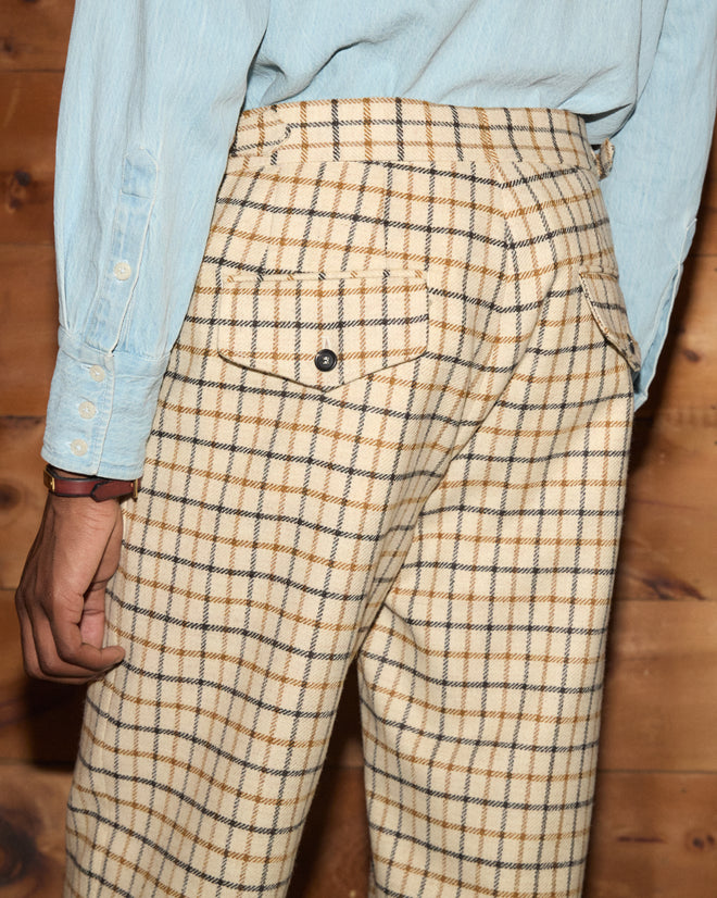 Sandhill Plaid Trousers in beige tweed with a brown and black check pattern and buttoned back pockets.