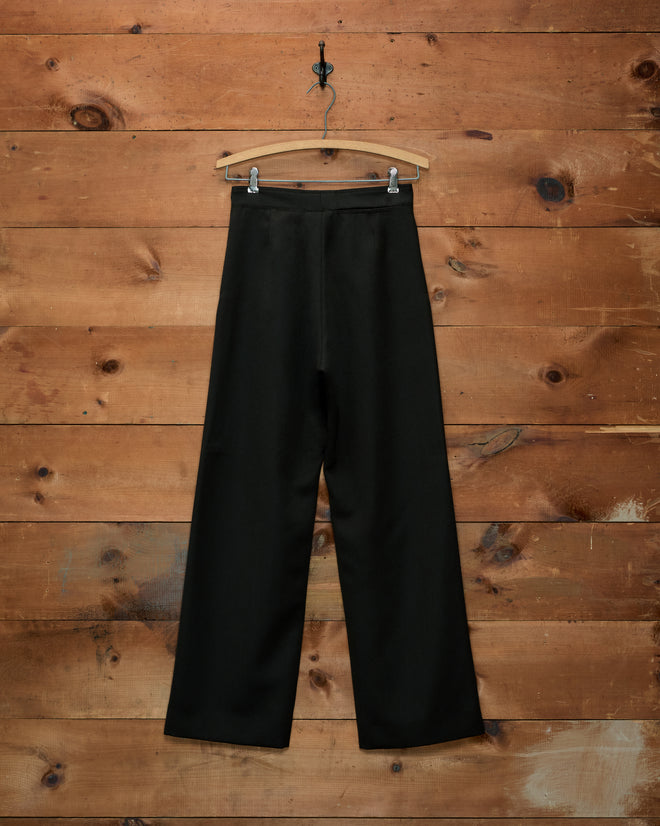 Cavalry Sailor Trousers: navy wide-leg trousers with gold horsehead buttons on a wooden hanger.