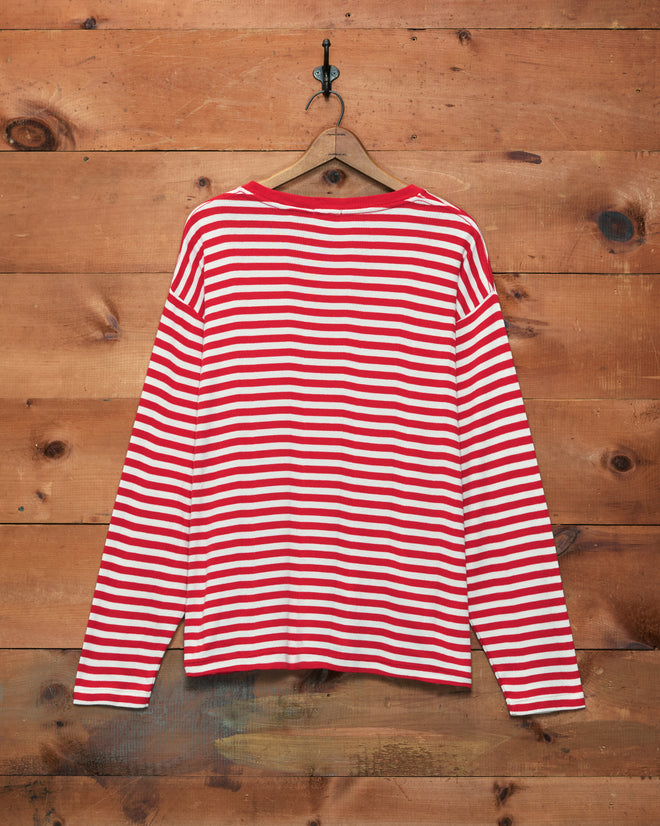 Rib Stripe Horseshoe Long Sleeve Tee in red and white stripes, displayed on a wooden hanger against a wood plank wall.