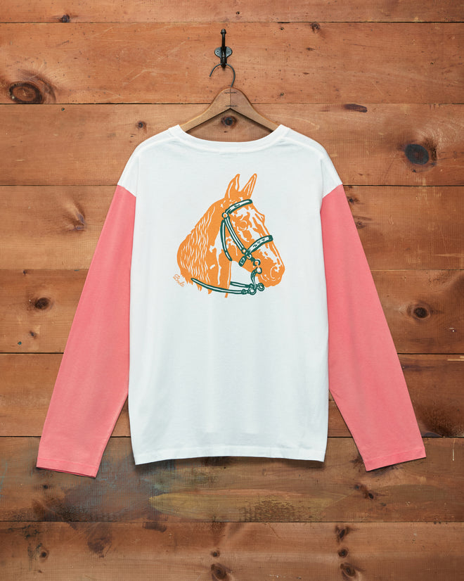 Checkers Baseball Tee featuring pink long sleeves and a bold orange horse head graphic on the back, crafted from 100% cotton and displayed on a wooden wall.