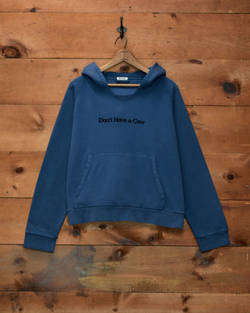 Roughrider Hoodie in washed blue with a hood, front pocket, and “Don’t Have a Cow” embroidery.