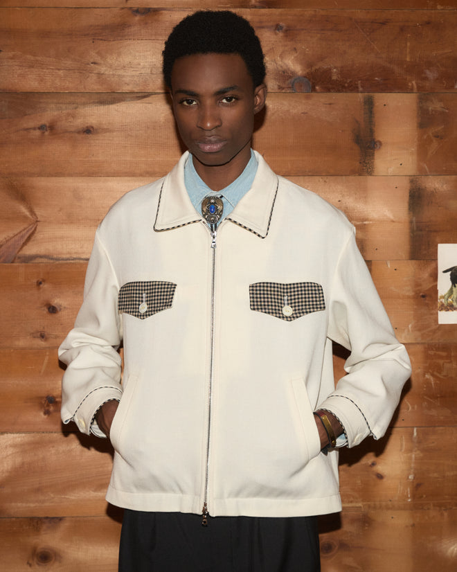 Off-white Stockton Jacket for children with a zip-up front, plaid pocket flaps, and a bolo tie.