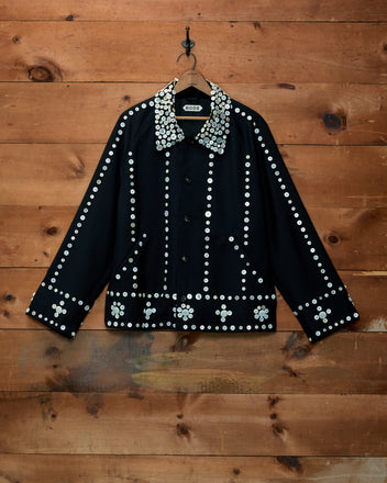 Pearly Royal Jacket, a black button-down featuring rows of white and silver pearl buttons on collar, sleeves, and hem.