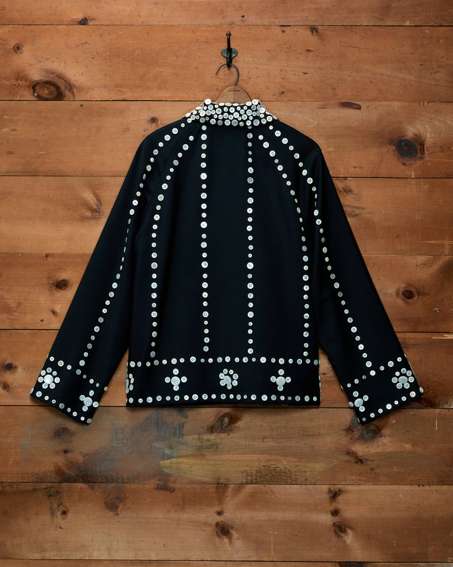 Pearly Royal Jacket, a black jacket covered in vertical rows of mother-of-pearl buttons in an antique-inspired style.
