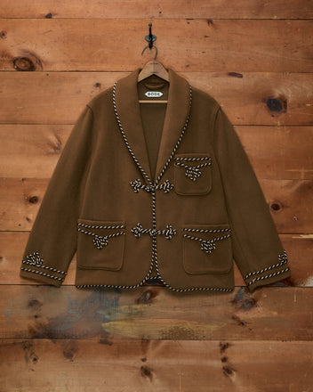 Bradford Smoking Jacket in brown velvet with a shawl collar and decorative rope toggle closures on the front and pockets.