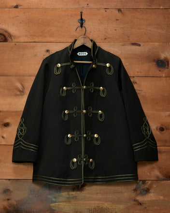 Cavalry Coat in black wool with gold braided toggles, soutache trim, and embroidery.
