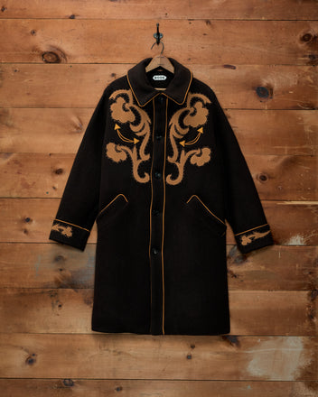 Ponderosa Appliqué Coat: dark brown western swing coat with tan floral appliqués and orange piping.