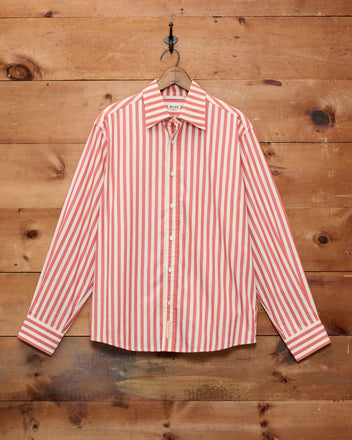 Rancho Long Sleeve Shirt in classic red and white vertical stripes, featuring a button-up design and displayed against a wooden wall. Crafted from 100% cotton and made in India, this shirt embodies timeless style and superior craftsmanship.