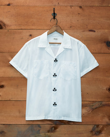 Clover Charm Short Sleeve Shirt in white cotton poplin with black club-shaped buttons.