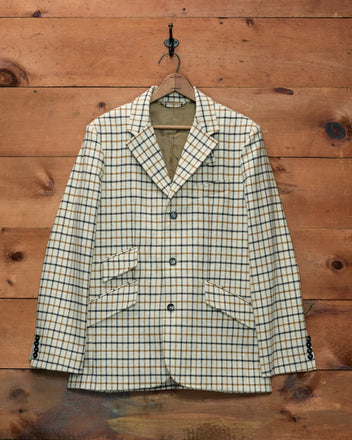 Sandhill Plaid Hacking Jacket in cream and brown checked tweed with three front buttons and a ticket pocket.