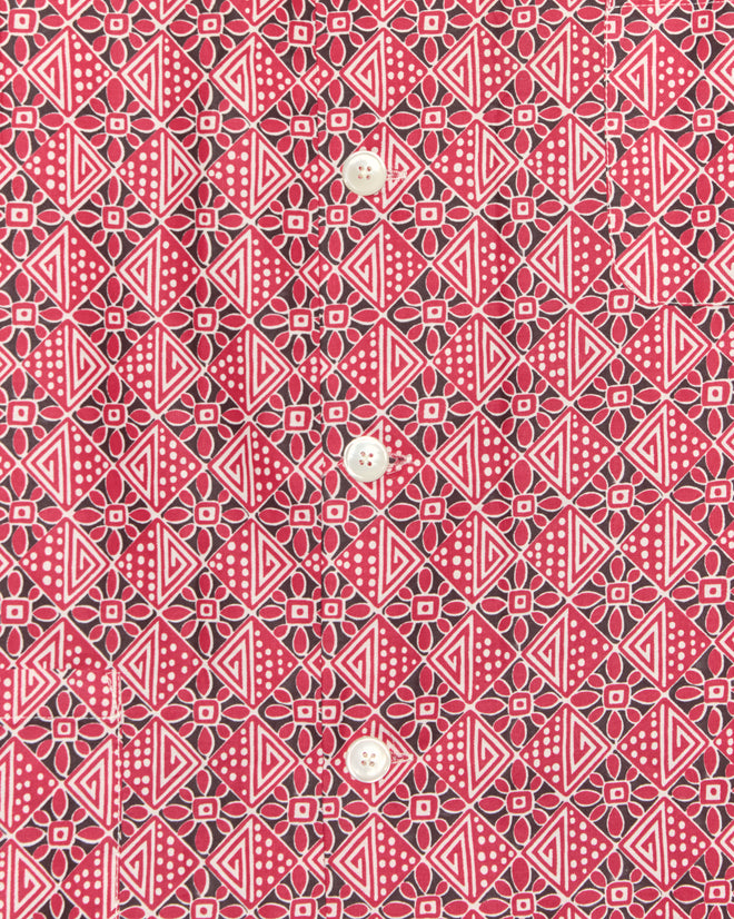 The Organic Geometry Shirt - XXL features red and black geometric patterned fabric with white buttons vertically down the center, making it a unique piece crafted from vintage textile.