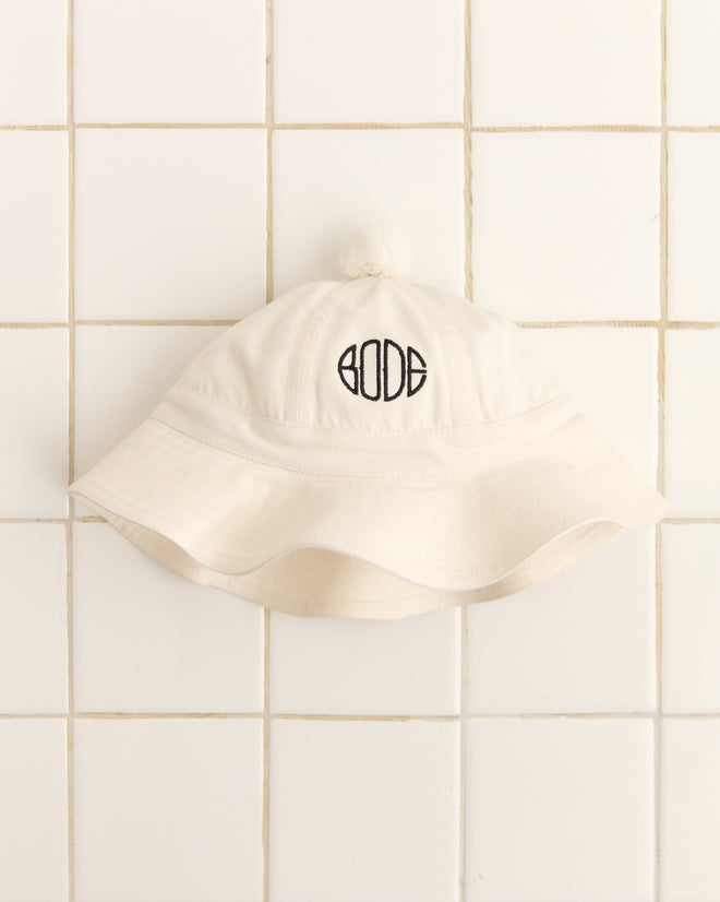 The Paneled Grandfather Hat - White features a cream canvas design with a top pom-pom and 