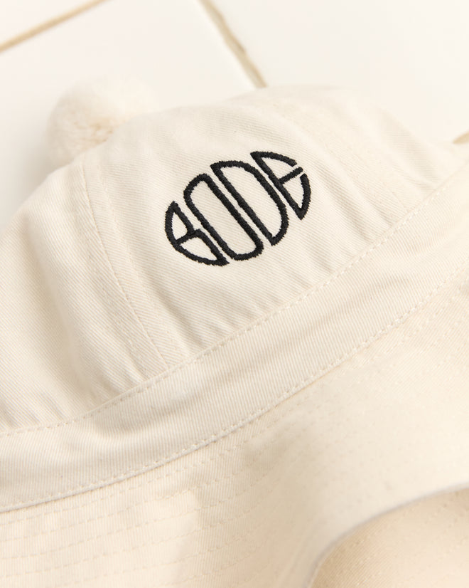 The Paneled Grandfather Hat - White, featuring a black embroidered 