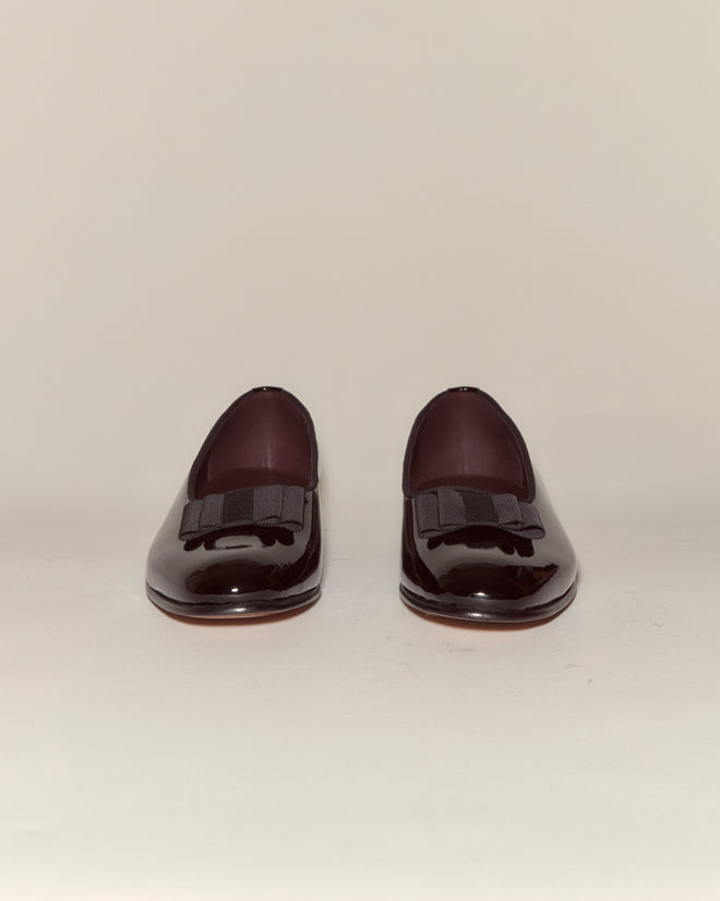 A pair of Patent Opera Pumps in shiny black patent leather with decorative bows, photographed against a plain light background.