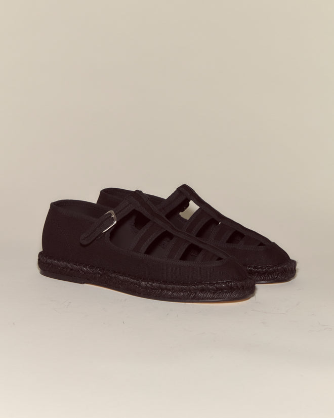 Peggy Espadrilles - Black feature black closed-toe design, woven jute soles, and multiple straps. Set against a plain background, they make the ideal summer leisure shoes.