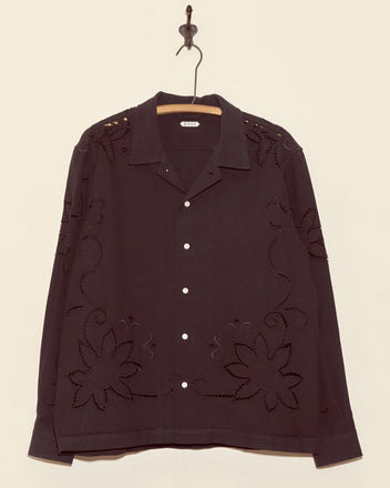 Petal Cutout Long Sleeve Shirt - XL with black floral cutouts, vintage tablecloth-inspired, displayed on a wooden hanger against a beige wall.