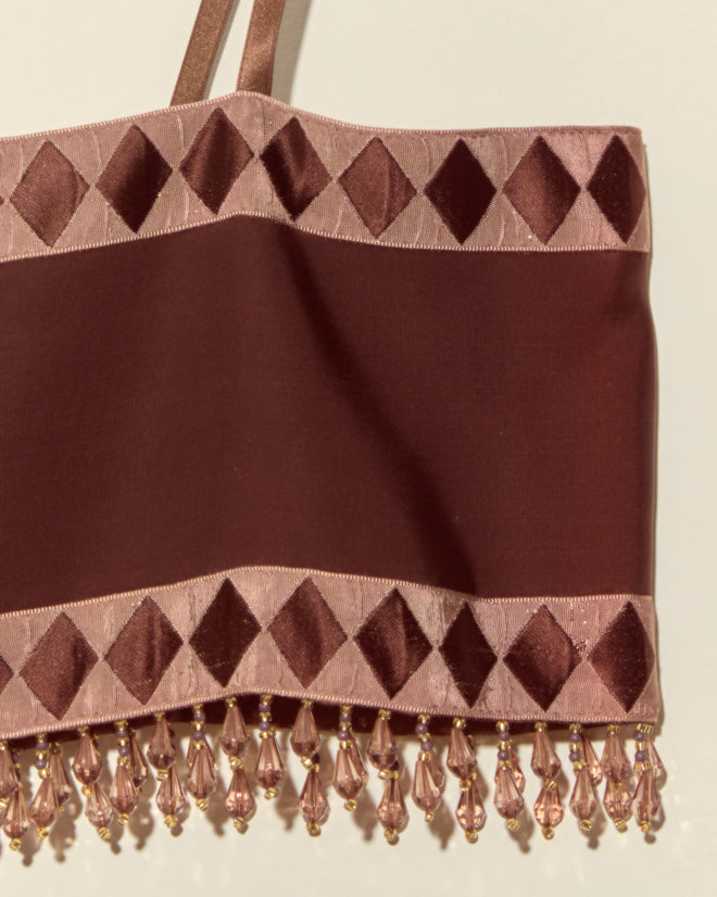 The Pierrot Bead Bra - S is a maroon crop top with pink diamond trim, beaded fringe, and unique Staron jacquard ribbon for a standout bra look.