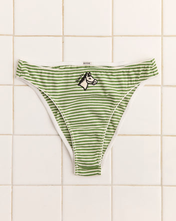 Pony Briefs: Green and white striped high-cut briefs with an appliquéd horse patch, shown on a white tiled background.