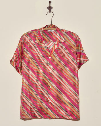 The Railhead Blooms Shirt - M/L is a unique short-sleeve shirt with red, pink, yellow, and white diagonal stripes, made in New York and displayed on a hook.