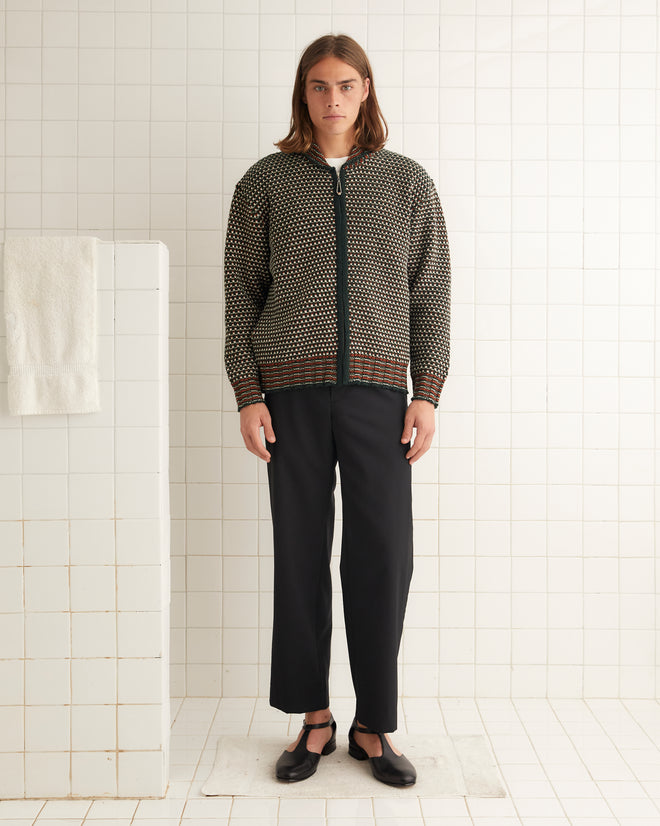 Green, white, rust orange merino wool collared sweater with a ball-chain zipper and ribbed detailing around the collar, cuffs, and hem.