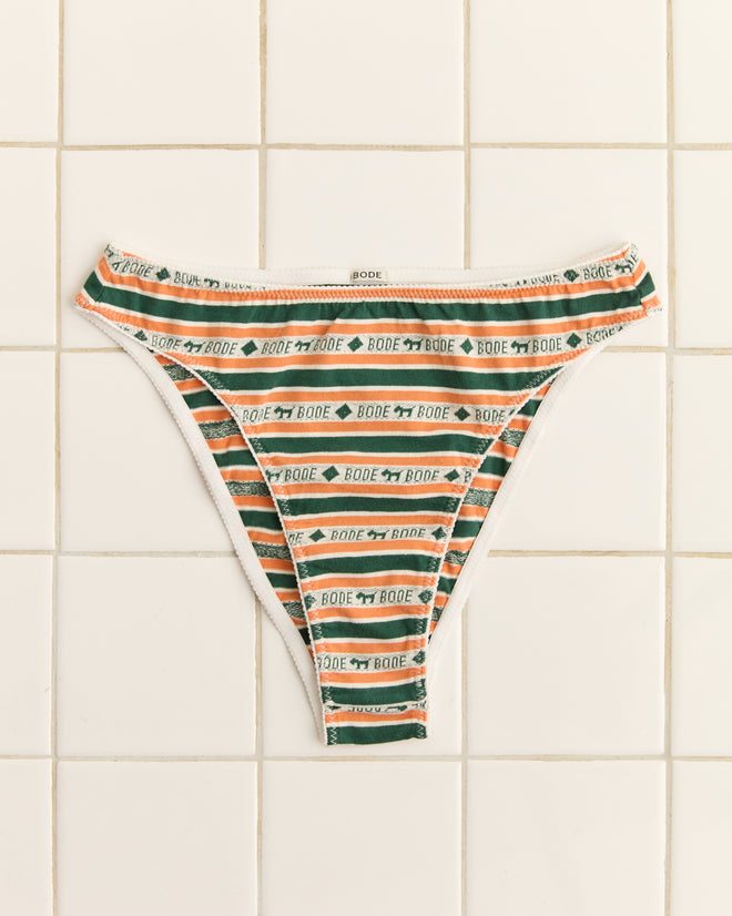 Scottie Jacquard Briefs boast green, orange, and white Scottie dog motifs on striped fabric, with "Bode" text, shown on a tiled surface.