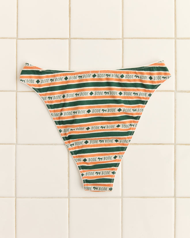 The Scottie Jacquard Briefs, featuring Bode text and charming Scottie dog motifs in a jacquard knit pattern, are displayed on a tiled surface.