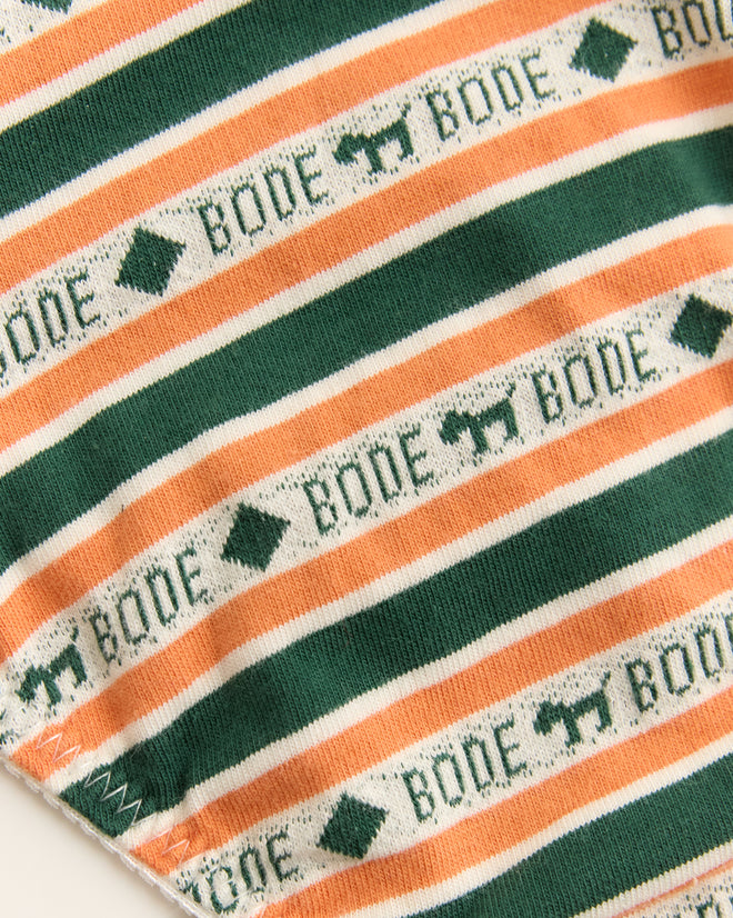 The Scottie Jacquard Briefs feature a striped design with green and peach lines, "BODE" text, and a diamond with horse silhouettes. This 1960s-inspired style adds a retro charm.