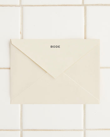 A sealed cream-colored envelope with the label 