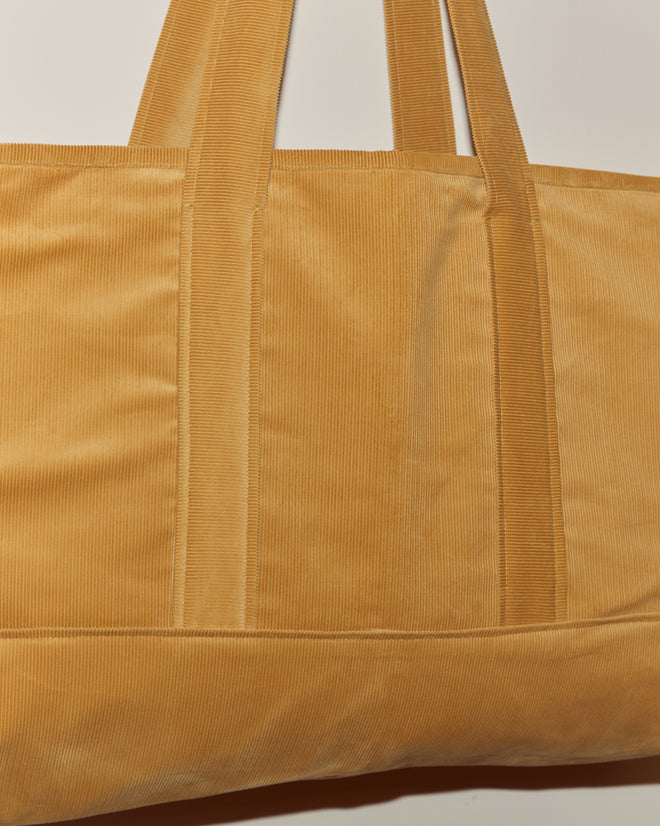 Close-up of the Custom Large Senior Cord Tote in tan, featuring two handles, shown against a plain light background.