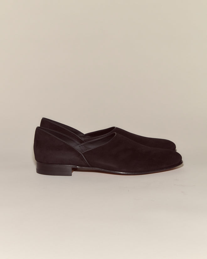 Suede House Shoes - Black: A stylish pair of Italian suede slip-ons with leather soles and low heels, shown against a plain light background.