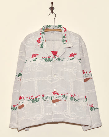 Team Ropers Overshirt - XL: White vintage cowboy button-up with red, green, and brown embroidered patterns, hanging on a hook.